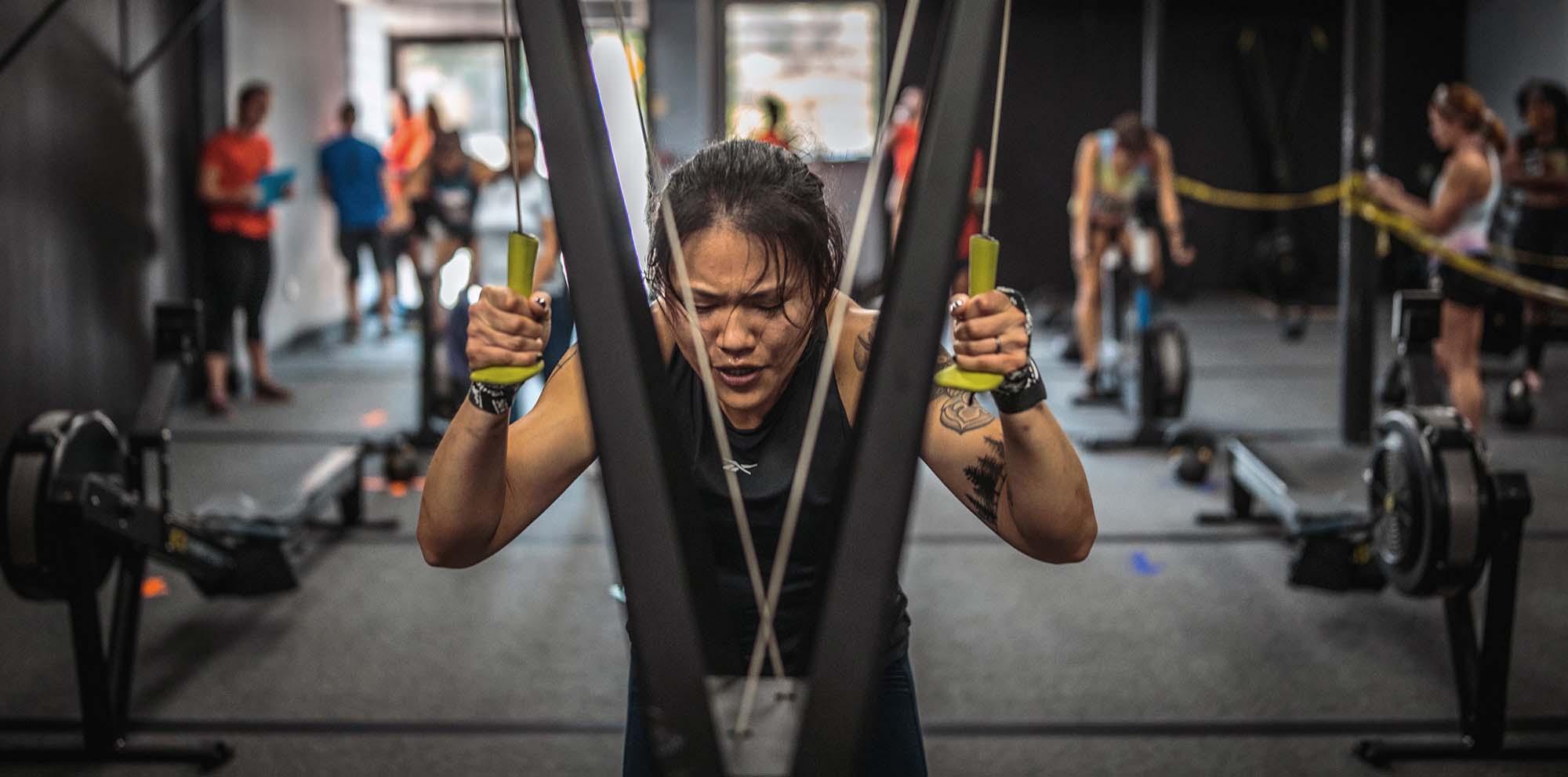 Picture of Michelle exercising with a ski erg machine